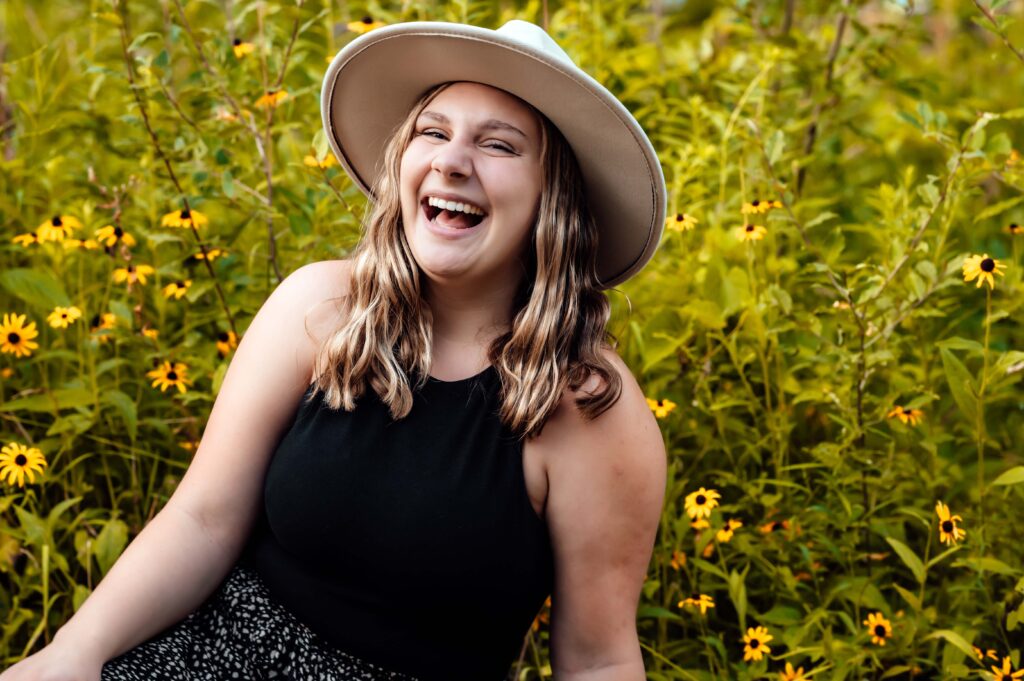 JMR_1357-Edit | Two Wild Souls Photography Senior laughing in the black-eyed Susans at Van Hoosen Farm in Rochester, Michigan