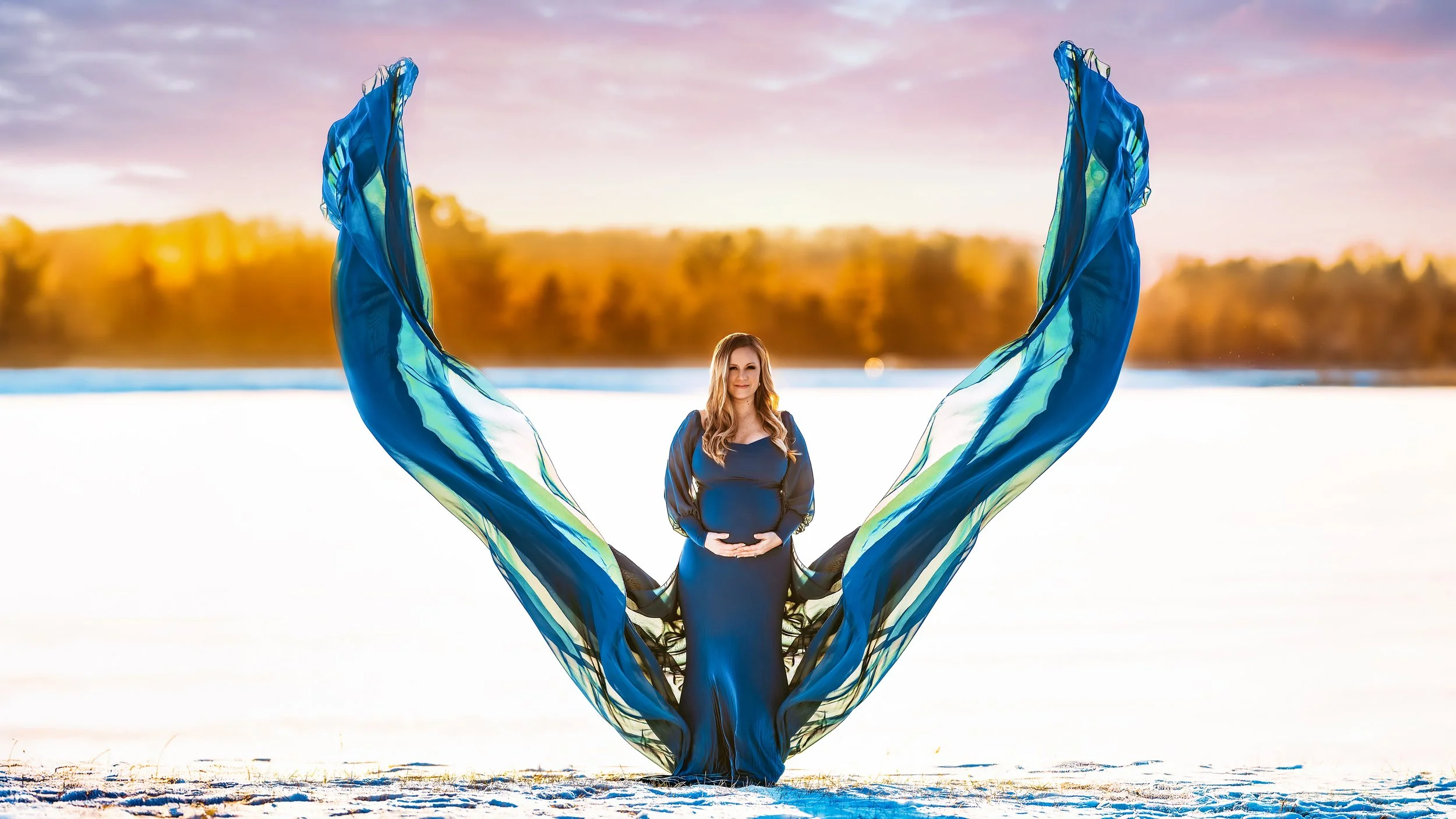 Pregnant Mother in Snow Winter Maternity Photography Session at Stony Creek Metropark during Sunset Golden Hour with Two Wild Souls Photography. 