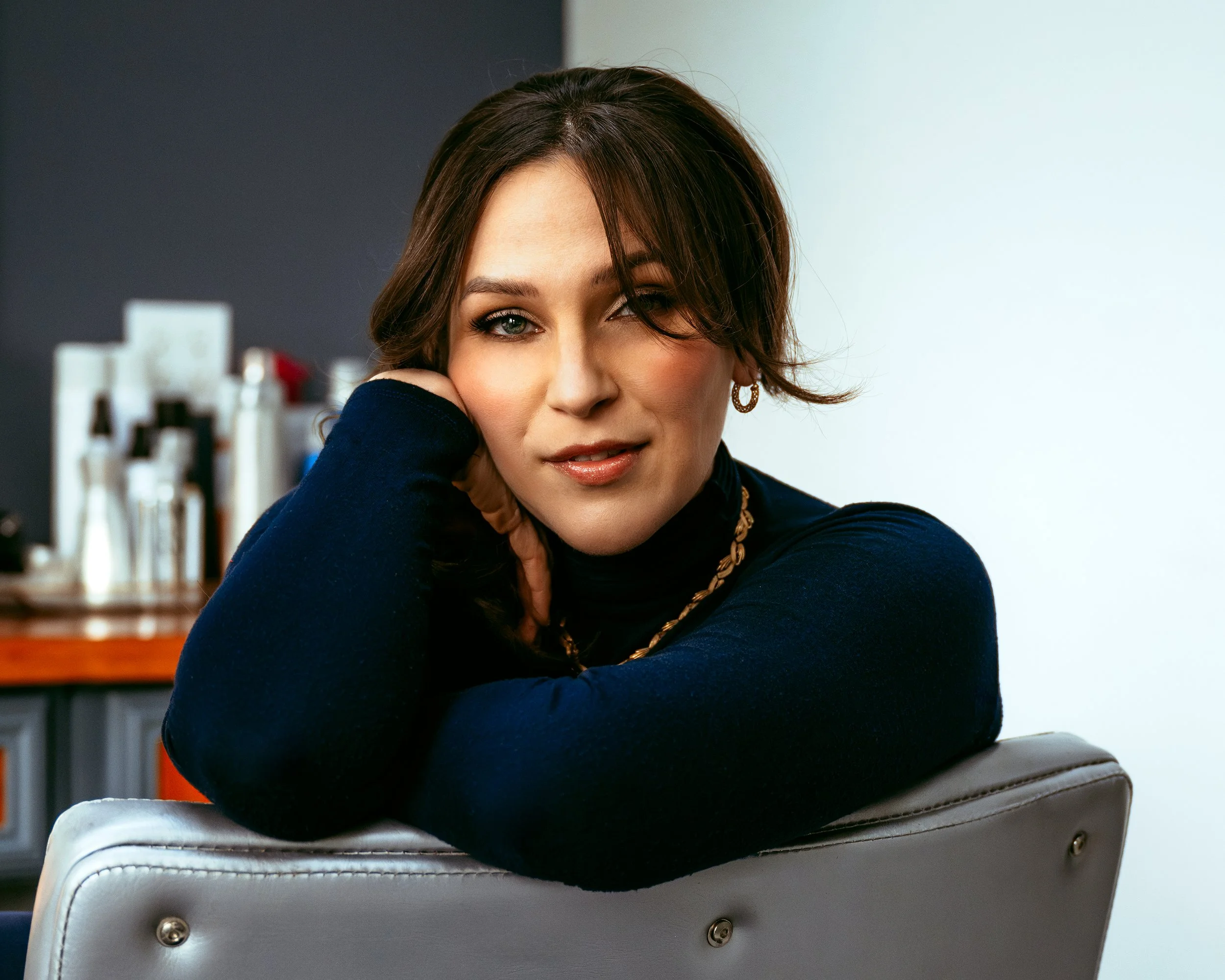 Hair and makeup stylist posing during branding session with Two Wild Souls Photography