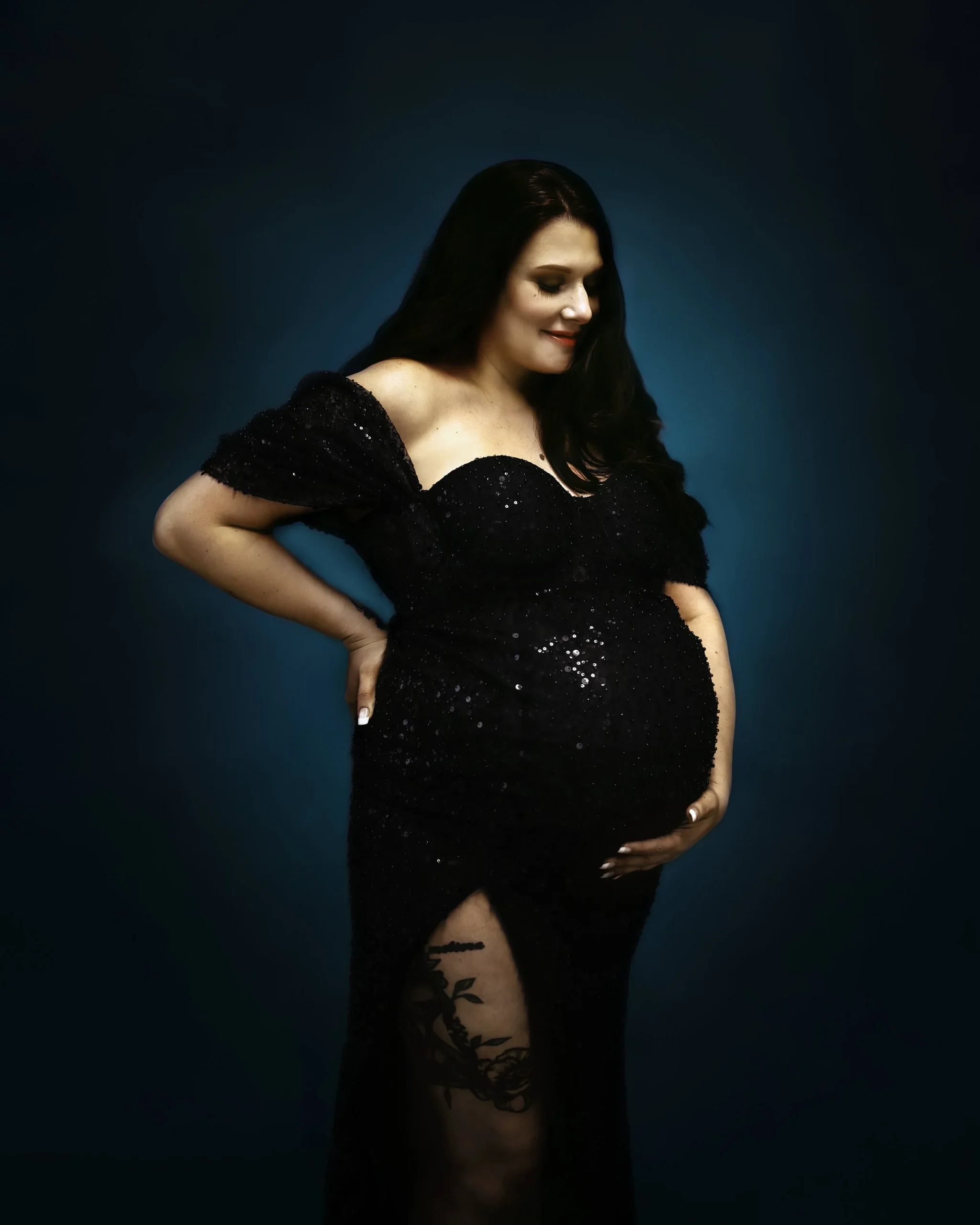 Mother holding her baby bump at an In-studio Maternity Photography Session with Two Wild Souls Photography