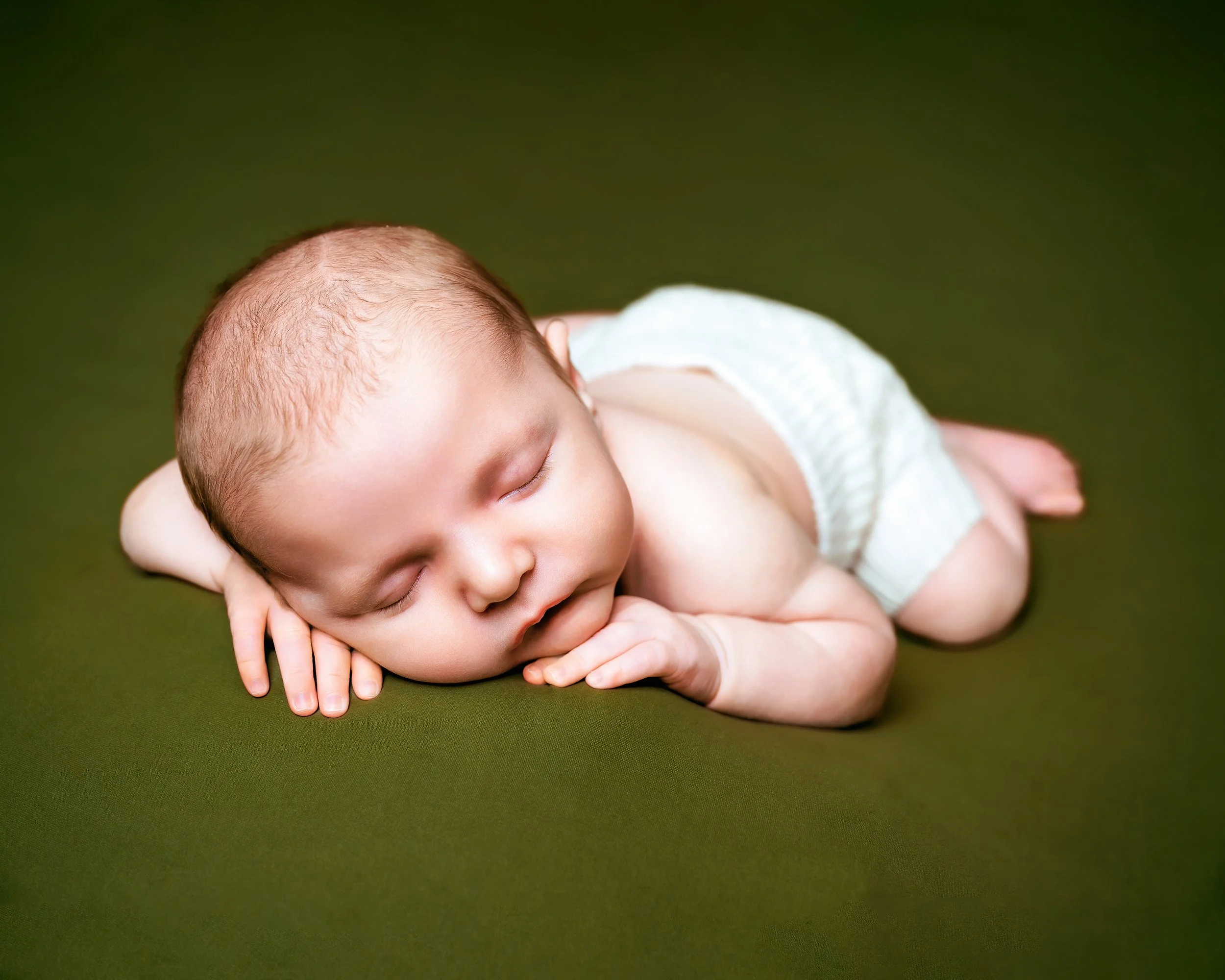 Newborn sleeping with knit shorts at Newborn Photography Session with Two Wild Souls Photography